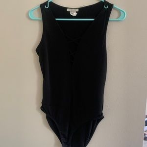 Ambiance Size S/M black bodysuit with crisscross cutout front